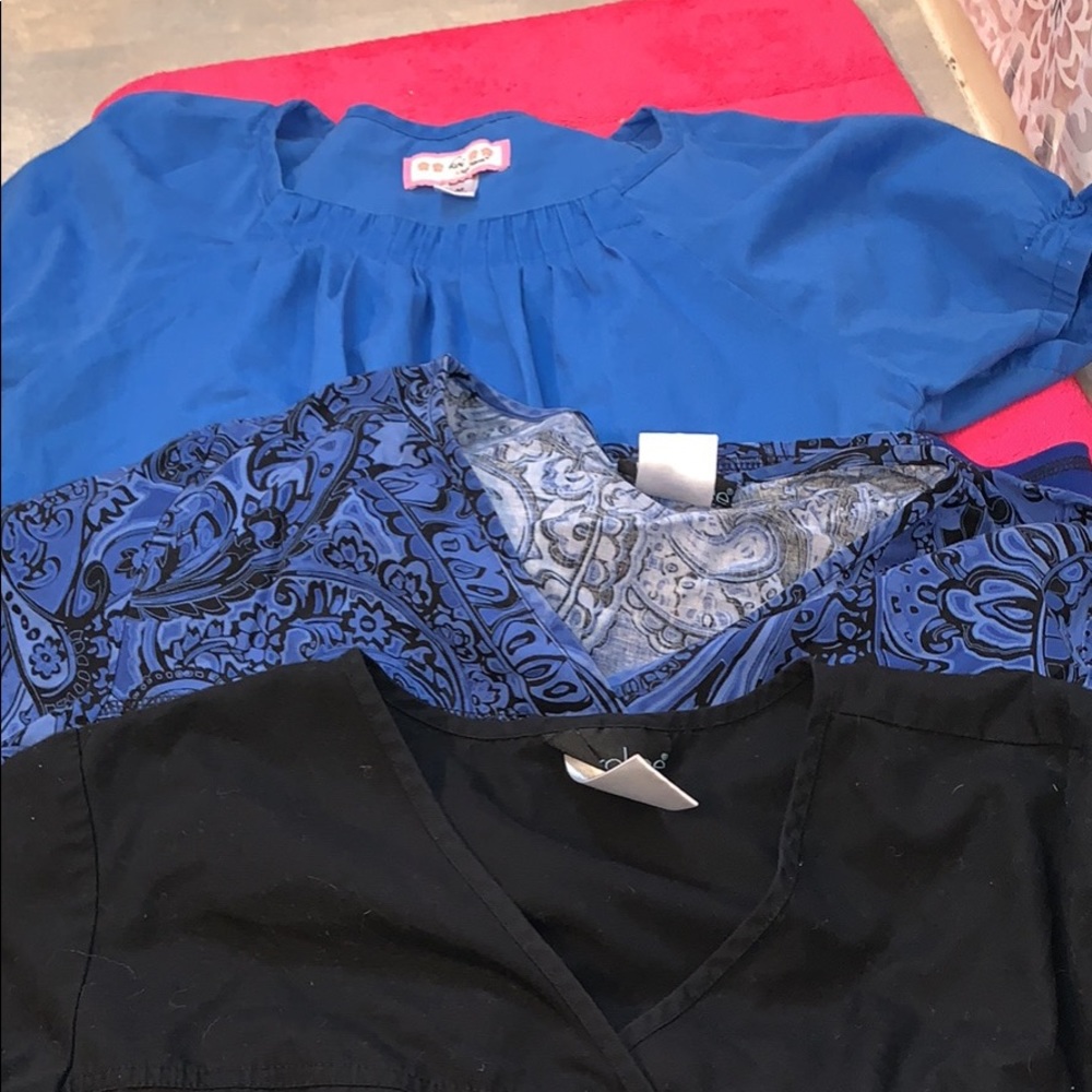 three medium scrub tops